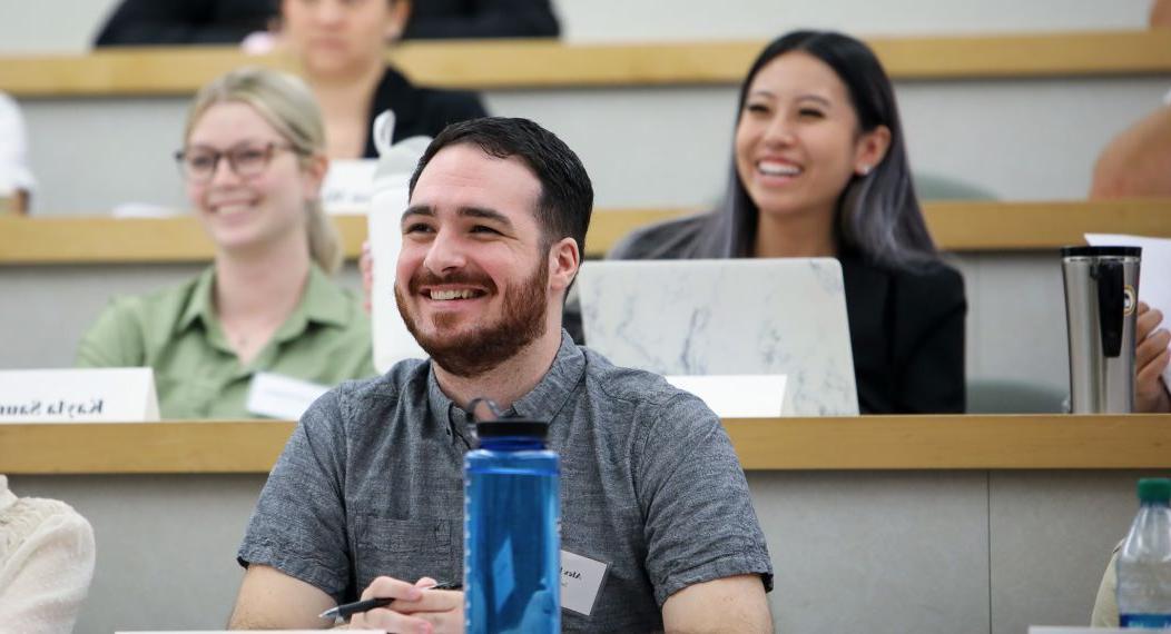 students in classroom smiling